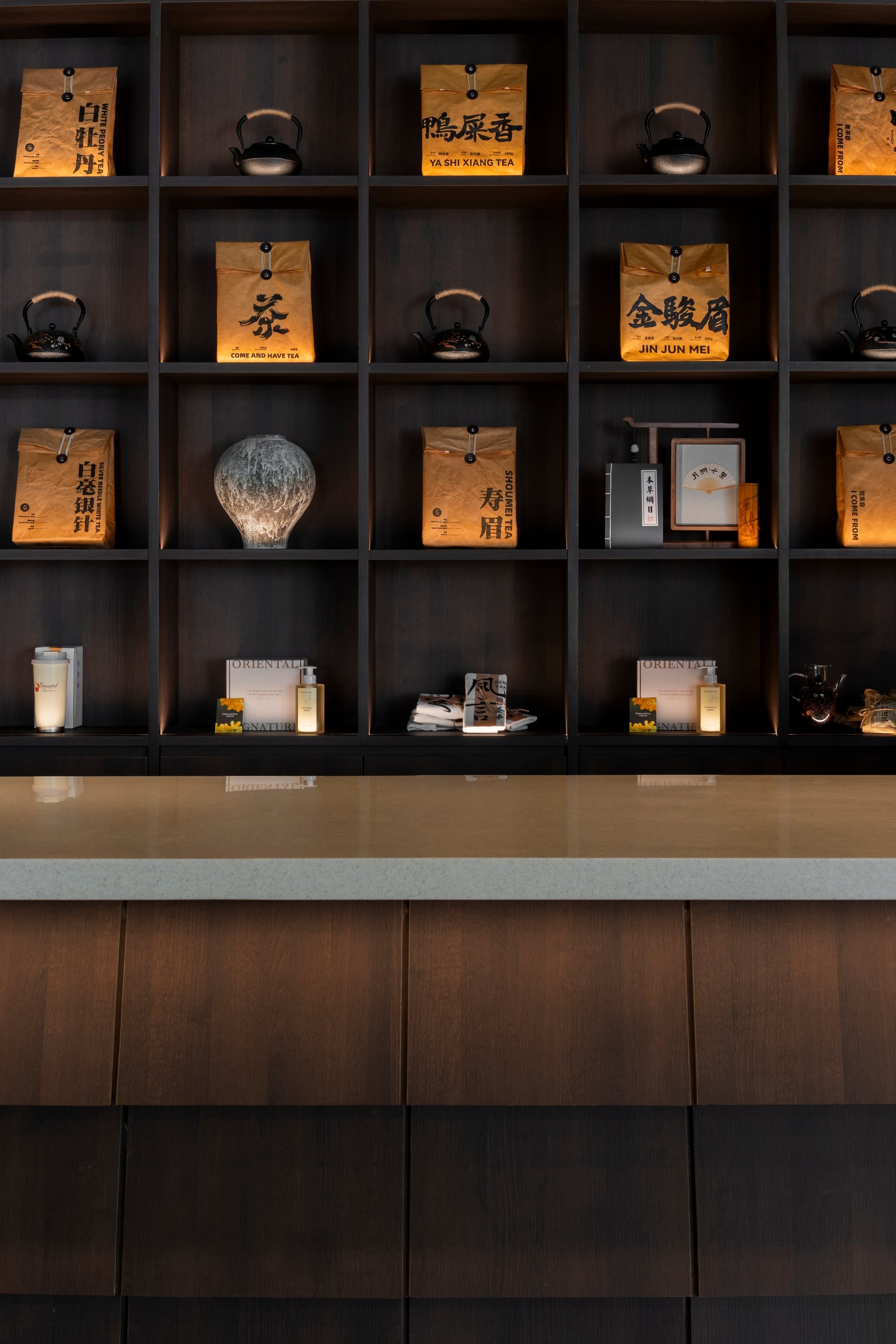 Spa tea display shelf detail, warm accent lighting, Oriental Spa, Kuala Lumpur